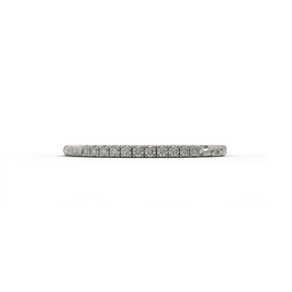 Delicate white gold diamond wedding band with pavé setting and organic hammered texture, handcrafted by Fluid Jewellery. Available at Ruby Mardi in Montreal.