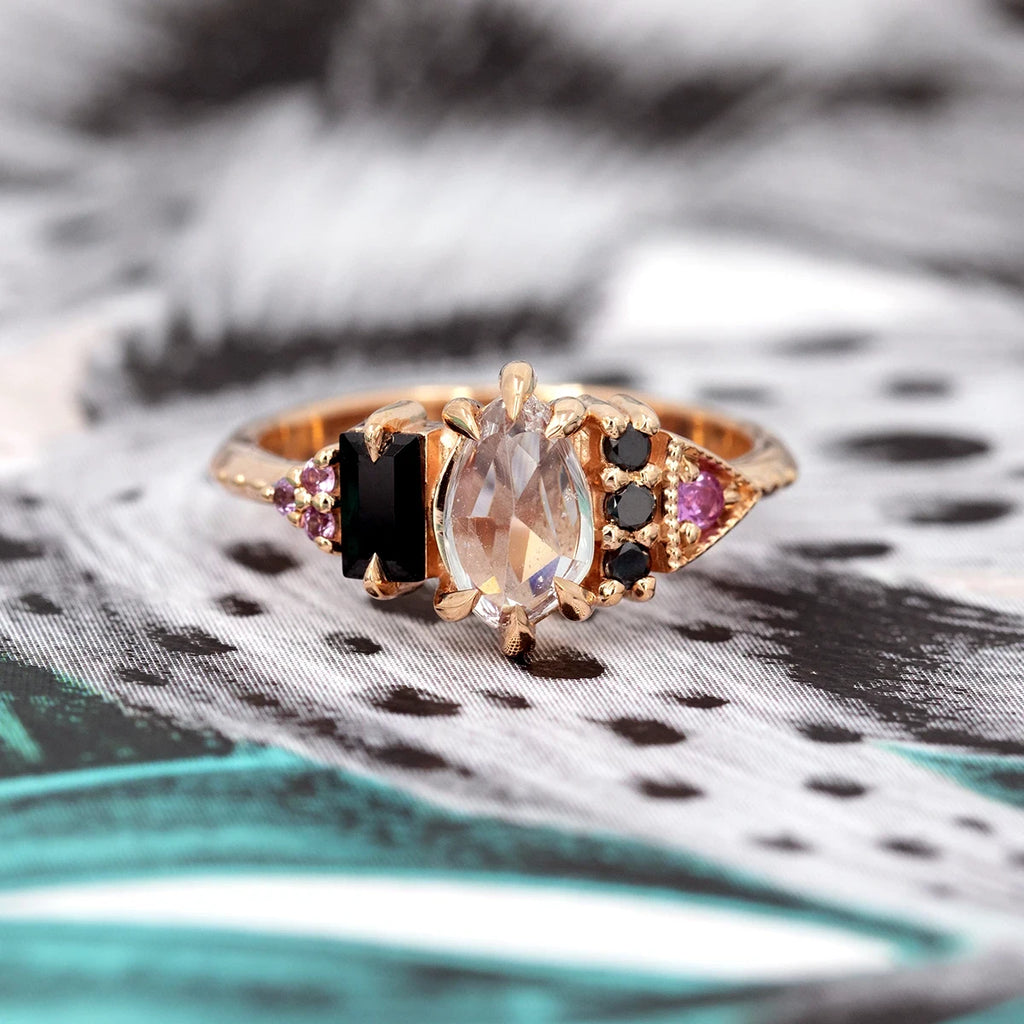 Modern 10k rose gold ring with pink sapphire and black spinel, designed by Nadia Werchola. Available at Ruby Mardi, Montreal’s fine jewelry store.