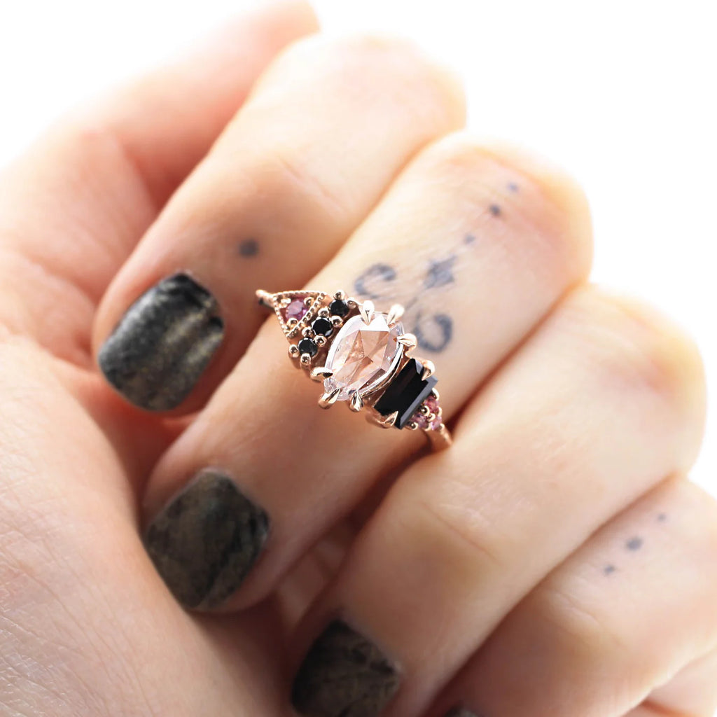 Pink sapphire and black spinel statement ring by Nadia Werchola, shown worn. Designer jewelry from Ruby Mardi, Montreal.