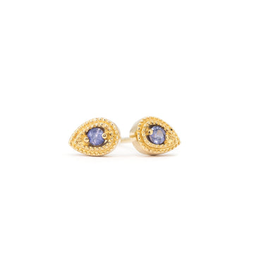 Stud earrings in 14k yellow gold, crafted by Canadian designer Emily Gill, featuring pear-shaped settings with fine milgrain details and set with round purple sapphires. Modern yet vintage-inspired jewelry, available at Ruby Mardi in Montreal.