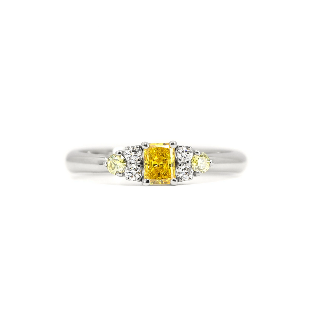 Radiant yellow lab-grown diamond ring in 10k white gold, with canary yellow and white diamond accents – Ruby Mardi Montreal.