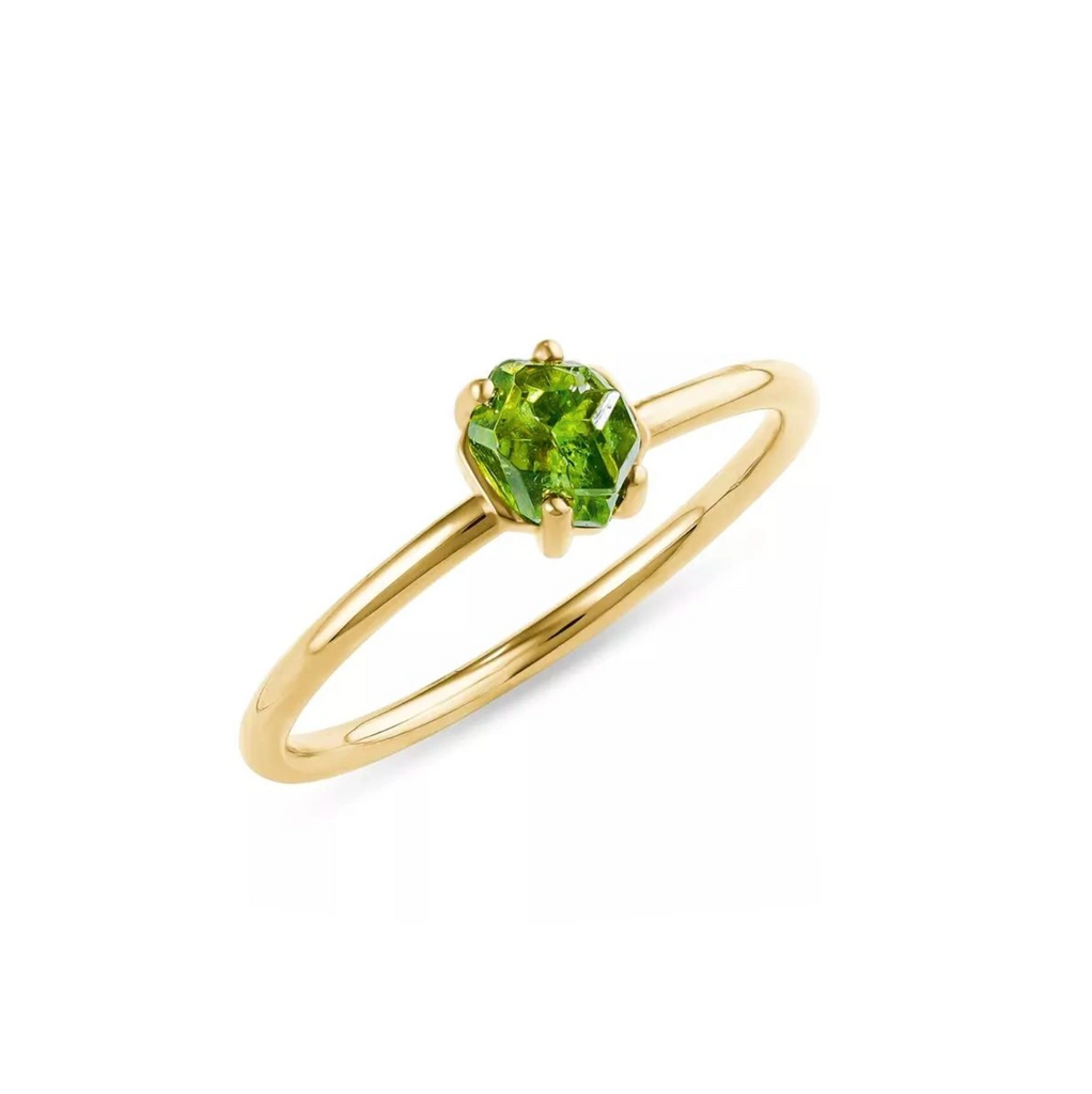 Bird's-eye view of a designer engagement ring featuring a raw demantoid green garnet custom made in 18k yellow gold. Exceptionnal and unique ethical gemstone ring handmade in Montreal by independent jeweller and jewelry designer François Charest, represented by fine jewellery store Ruby Mardi in Little Italy, Montréal.