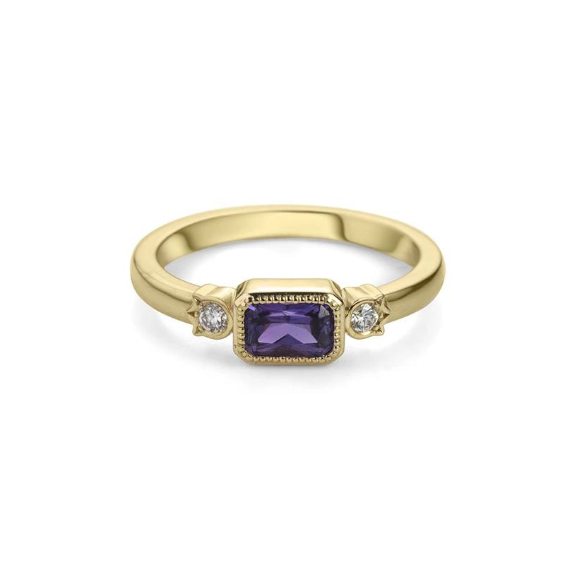 Ruby Mardi jewelry in collaboration with independent jeweler Bramston Goldsmithing, presents this splendid alternative engagement ring with a purple colored gem, which is a natural sapphire, in a bezel setting with a delicate miligrain, as well as two small side diamonds. This bridal ring is made in Canada and is available for sale at the Ruby Mardi jewelry store in Montreal.