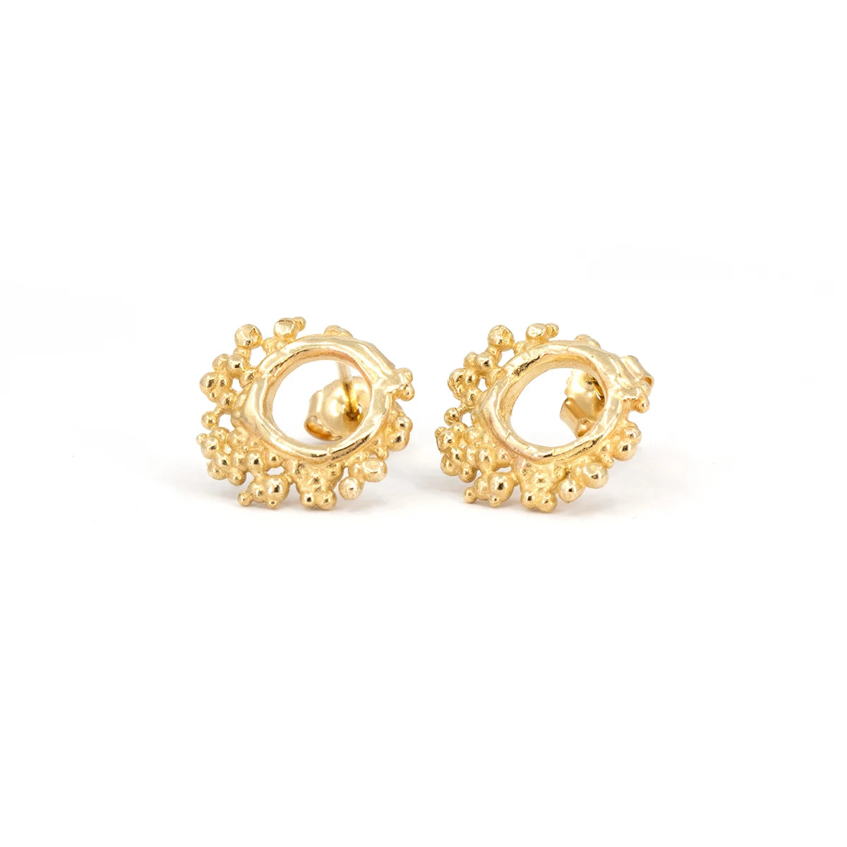 Organic-style round studs by Emma Glover, featuring ocean bubbles delicately nestled around small hoops, showcasing a nature-inspired design that captures the beauty of the sea. Exclusively available in Montreal at Ruby Mardi, perfect for adding a unique touch to any outfit.