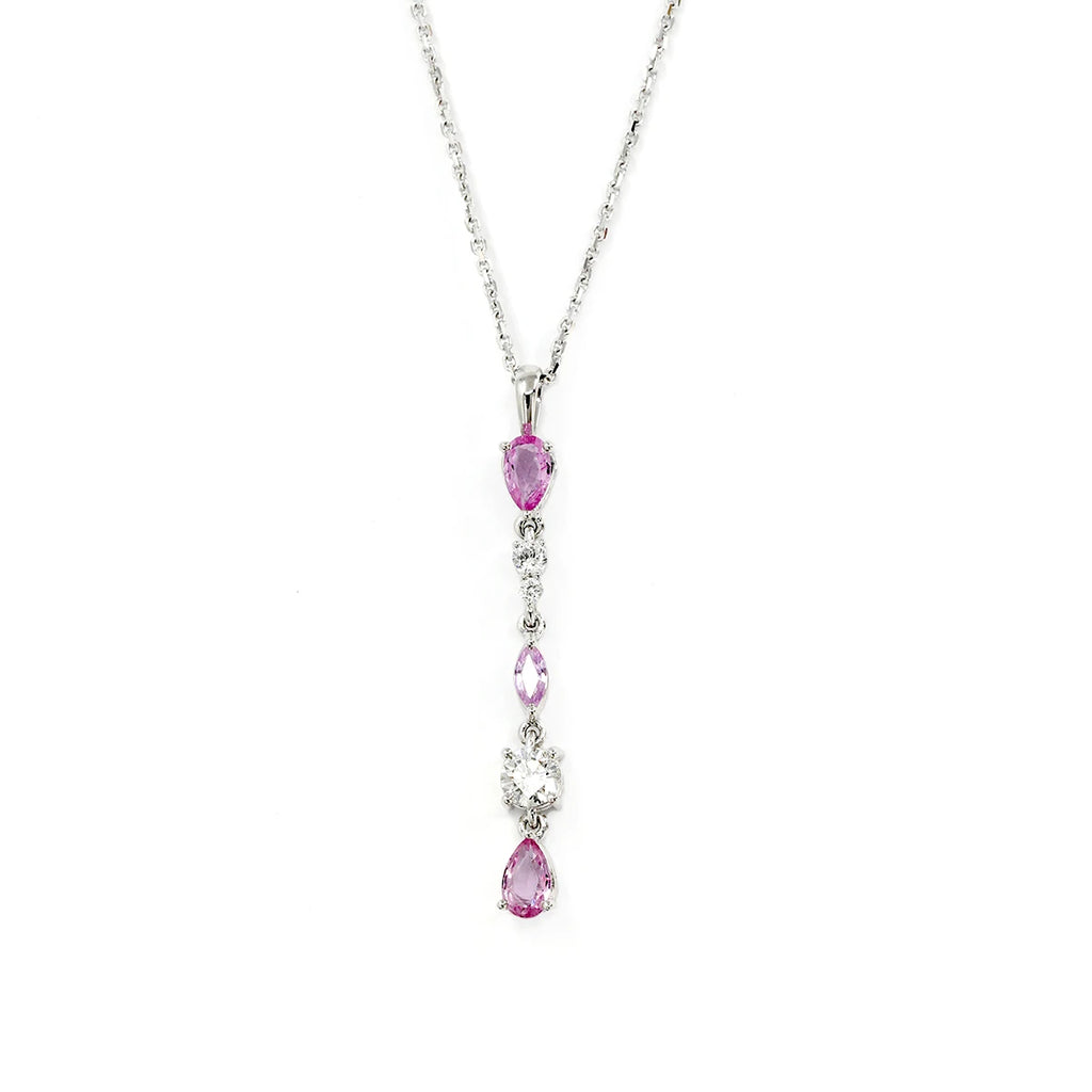 Splendid white gold pendant with pink sapphires and diamonds, made by independent jewelry designers VCL in Montreal. This high-end fine jewelry is made in Canada and available for sale at the Ruby Mardi jewelry store, a specialist in contemporary fine jewelry from an independent jewelry designer.