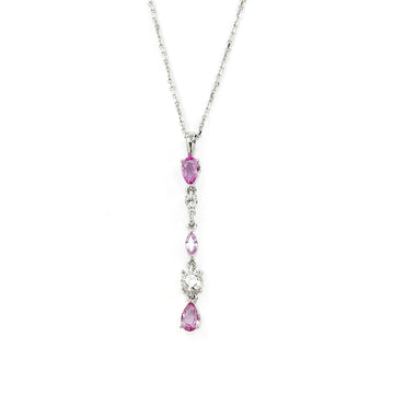 Splendid white gold pendant with pink sapphires and diamonds, made by independent jewelry designers VCL in Montreal. This high-end fine jewelry is made in Canada and available for sale at the Ruby Mardi jewelry store, a specialist in contemporary fine jewelry from an independent jewelry designer.