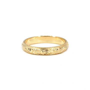 Hand-engraved scroll pattern gold wedding band with vintage milgrain edges, made by Deborah Lavery for Ruby Mardi, Montreal.
