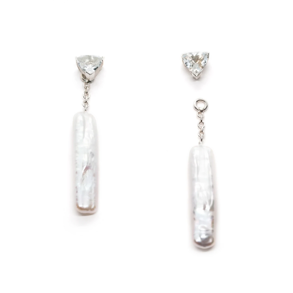 These earrings are made in silver with pearls and aquamarine gems by the independent jewelry designer Émigé in Montreal and exclusively for sale at the Ruby Mardi jewelry store. These drop earrings are elegant with an organic style.