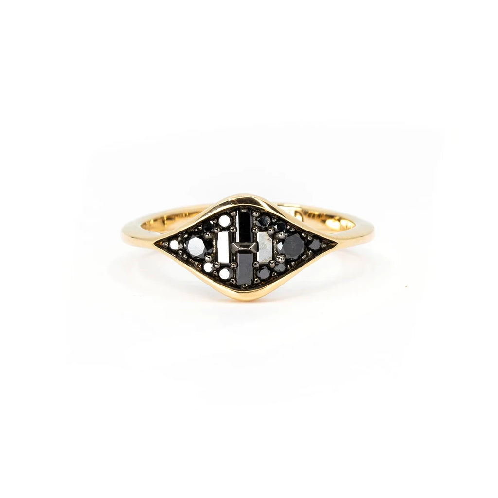A striking yellow gold ring featuring an intricate geometric design adorned with natural black diamonds in various cuts, handcrafted by Oleg Leybman. Available at Ruby Mardi, an independent jewelry store in Montreal’s Little Italy. We also offer custom jewelry services in Canada.