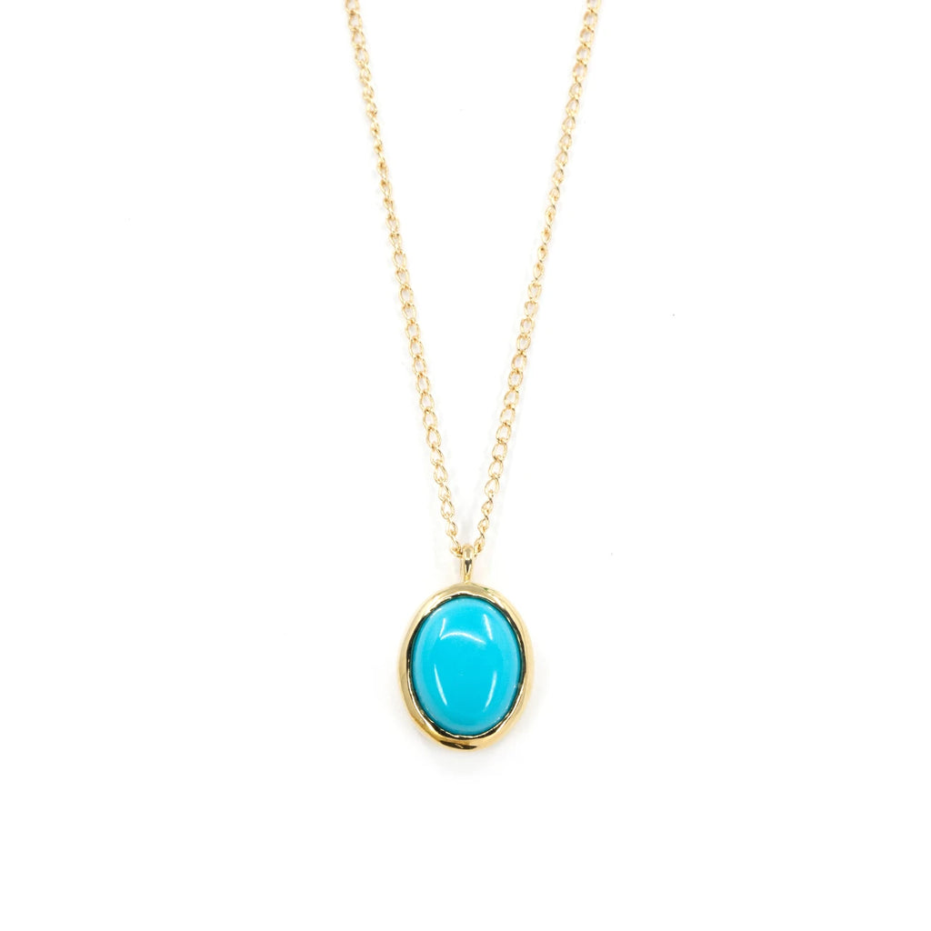A classic piece of jewelry photographed on a white background. Turquoise bezel set pendant. This December birthstone is well highlighted in this handmade necklace. Find more designer jewels at Ruby Mardi, who sells one-of-a-kind designer jewelry in Montreal, Canada.
