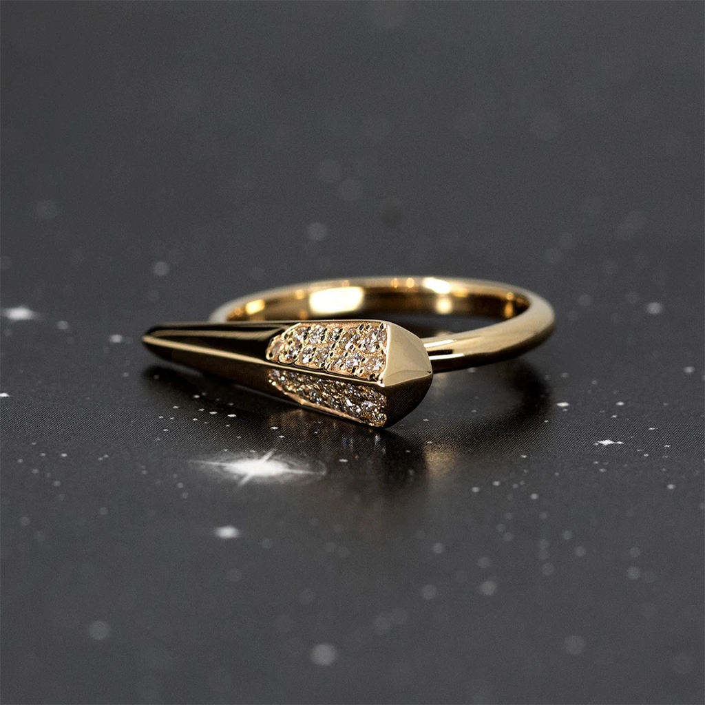 This edgy yellow gold ring with diamonds and geometric shape is made in Montreal by independent jewelry designer Bena Jewelry. This contemporary piece of jewelry is made by independent jewelry artisans in Canada and is available for sale or for presentation at the Ruby Mardi jewelry store and gallery.