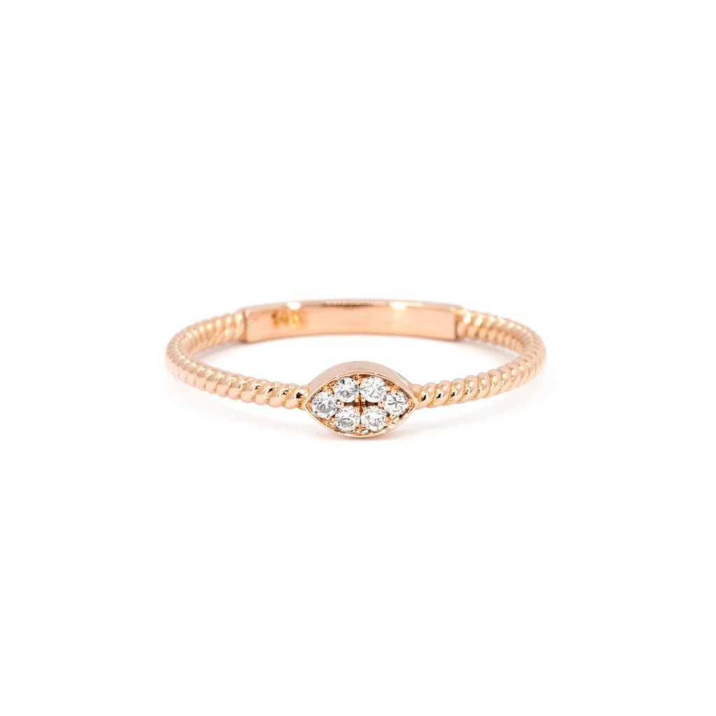 Minimalist rose gold ring with a twisted band and marquise-shaped cluster of natural white diamonds. Handcrafted by Oleg Leybman in Toronto, available at Ruby Mardi.