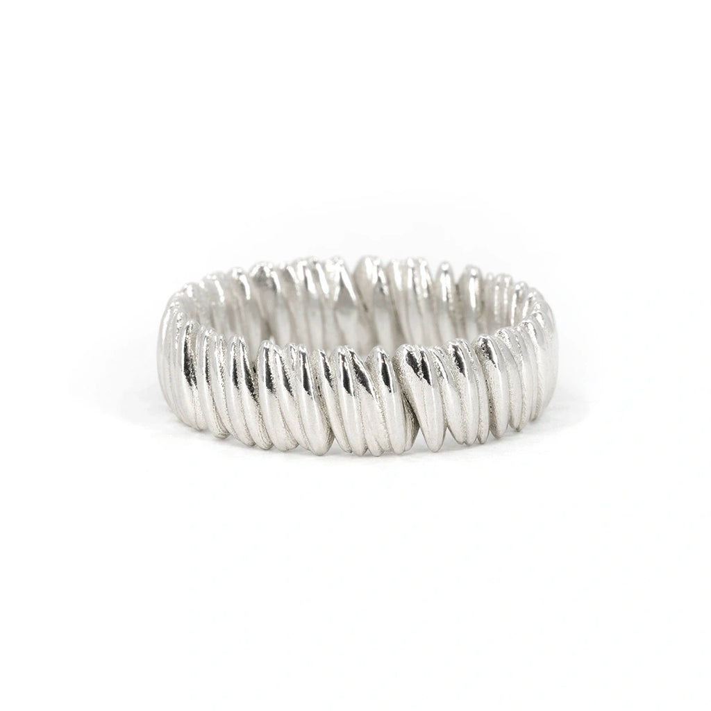 Chunky white gold wedding band with twisted ridges and a brushed matte finish, crafted by an independent jewelry designer in Montreal, Ruby Mardi.