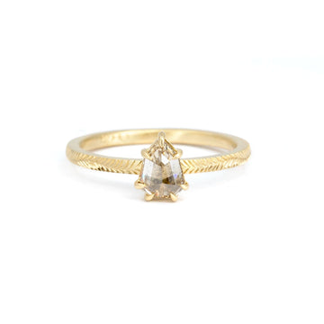 Front view of a shield-shaped rose-cut champagne diamond ring set in hand-engraved 14k Fairmined yellow gold. Designed by a Canadian jeweller, available at Ruby Mardi in Montreal.