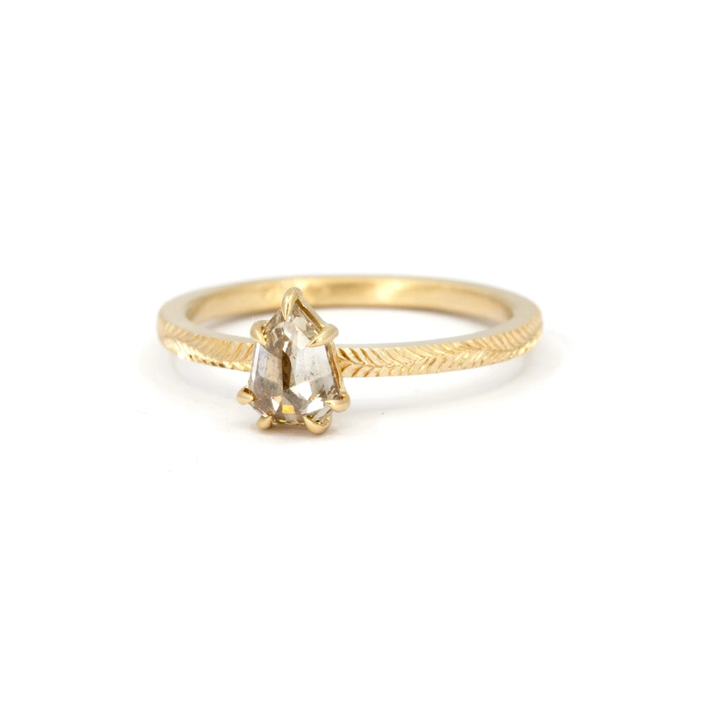 Hand-engraved 14k Fairmined yellow gold ring featuring a shield-shaped rose-cut Canadian diamond in a soft champagne hue. Designed by a Canadian jeweller, available at Ruby Mardi in Montreal.