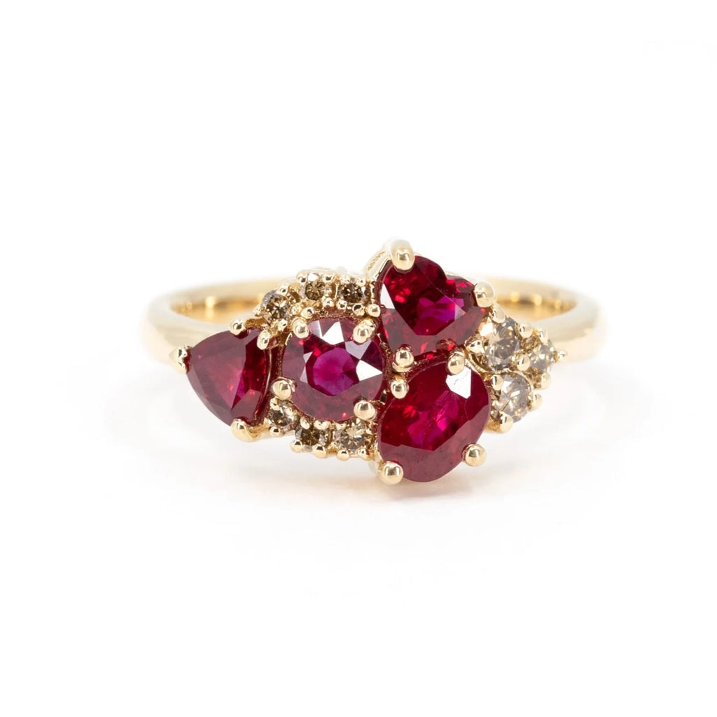 Bold Avalanche ring featuring a cluster of vibrant red rubies and diamonds, set in yellow gold. A bespoke creation by Ruby Mardi in Montreal.