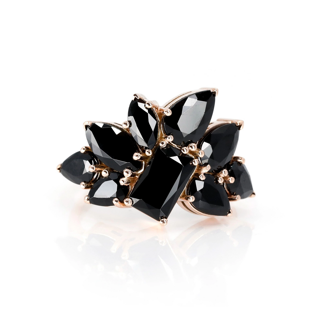 This statement ring is made up of black gems in various shapes, including pear and marquise. Made in rose gold by independent Canadian designer Bena Jewelry specializing in edgy jewelry with large volume. This bold and cocktail piece of jewelry is available for sale at the Ruby Mardi jewelry store in Montreal.