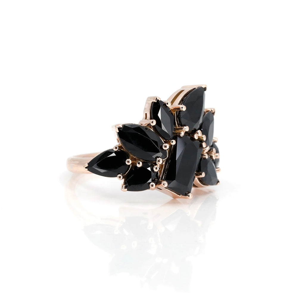 The Avalanche ring by independent jewelry designer Bena Jewlery is made in rose gold with black colored gems in rectangular, pear and marquise shapes. This statement piece of jewelry is bold and is a unique creation made in Canada.