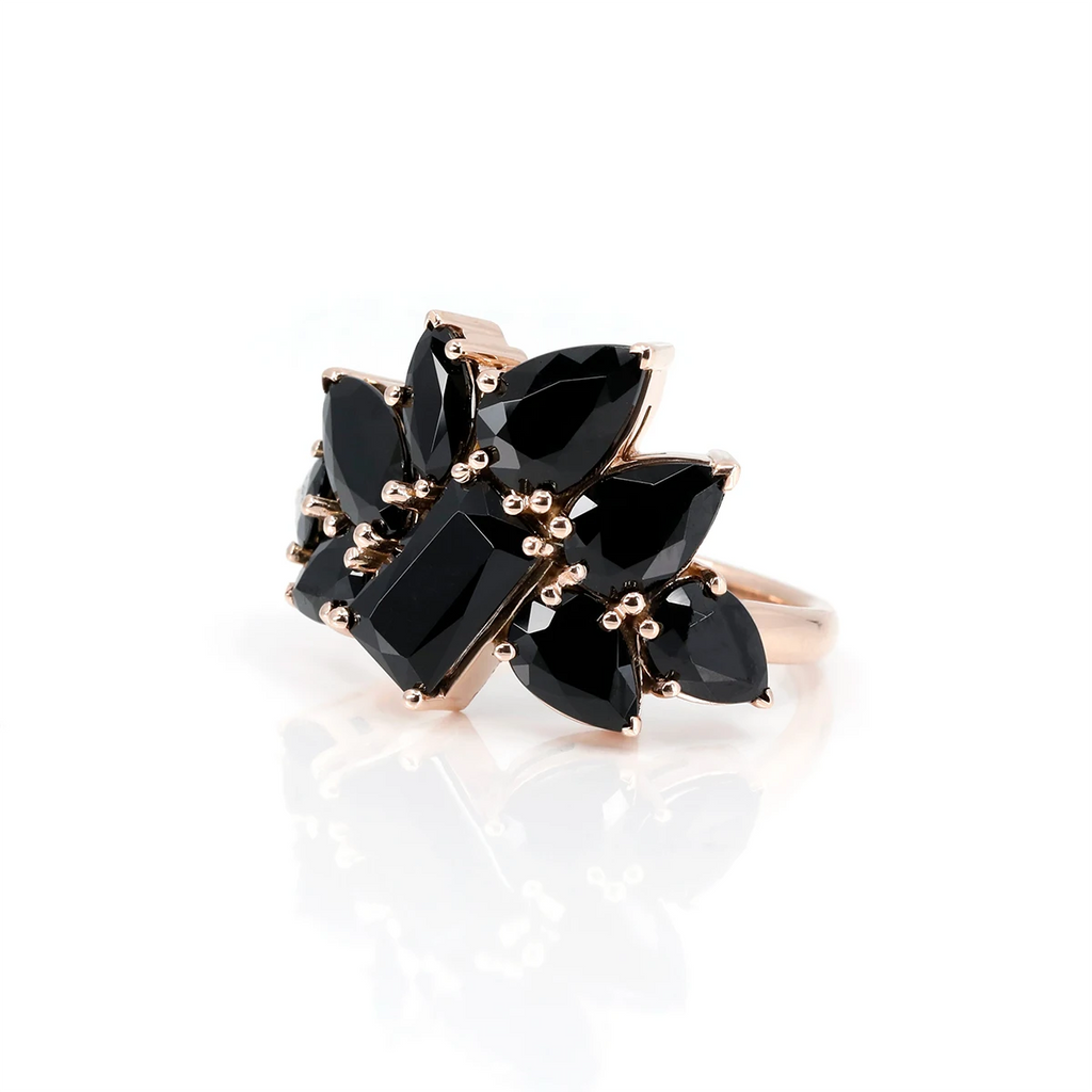 The Avalanche ring with black gems and mounted on rose gold is a custom creation by independent Canadian designer Bena Jewelry, specializing in cocktail jewelry and statement rings with a bold style. The Ruby Mardi jewelry store presents original jewelry.
