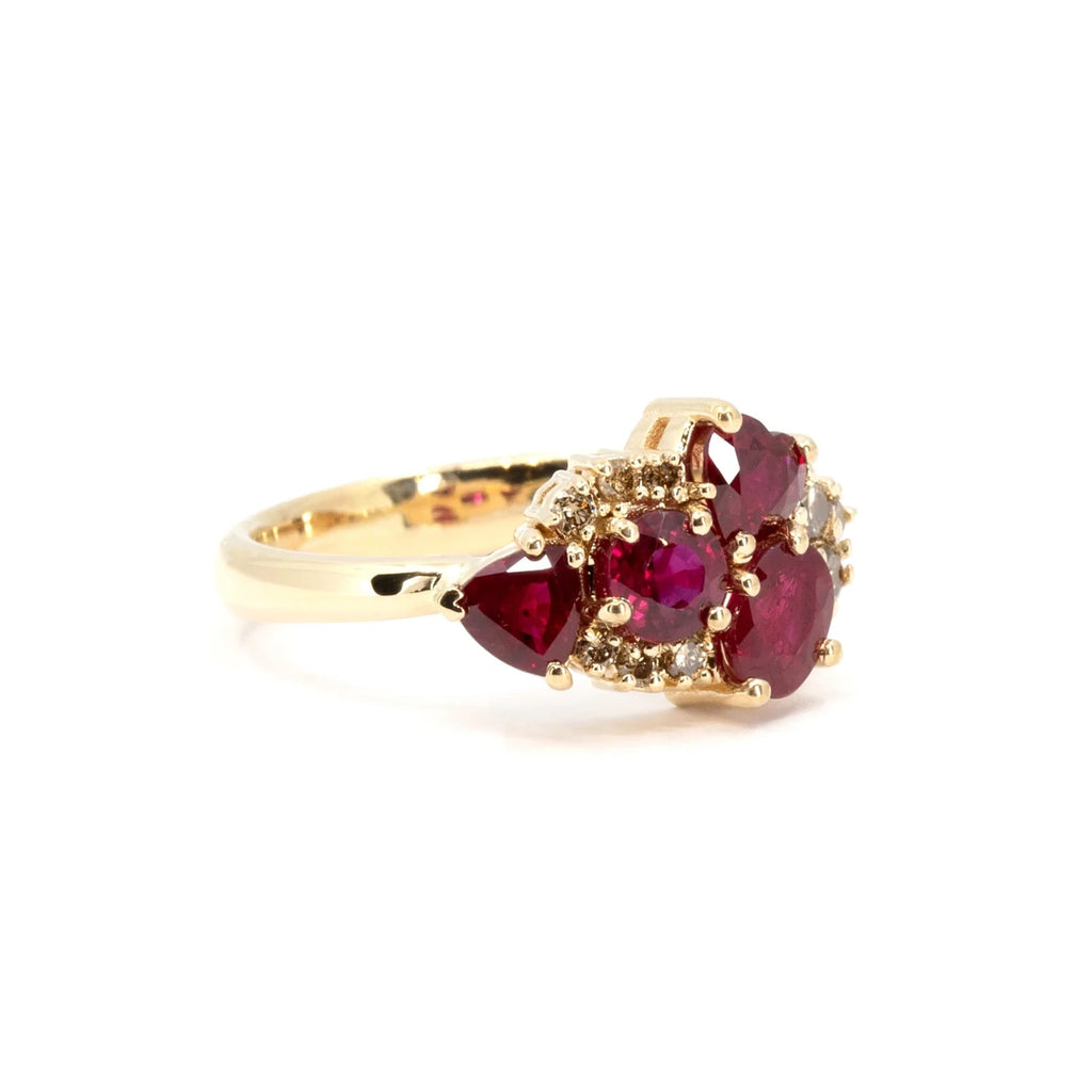 Alternate side view of the Avalanche ring highlighting the intricate setting of red rubies and diamonds in luxurious yellow gold. Handcrafted by Ruby Mardi in Montreal.