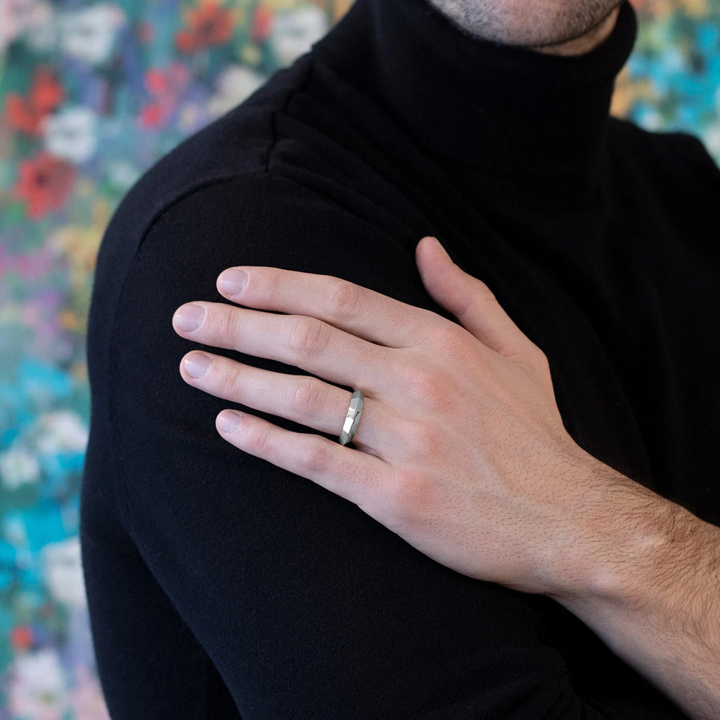 This men's wedding ring with style is worn by a man. The Ruby Mardi jewelry store specializes in gold men's bangles for weddings or custom engagement rings. We work exclusively with independent jewelry designers and Canadian jewelers.