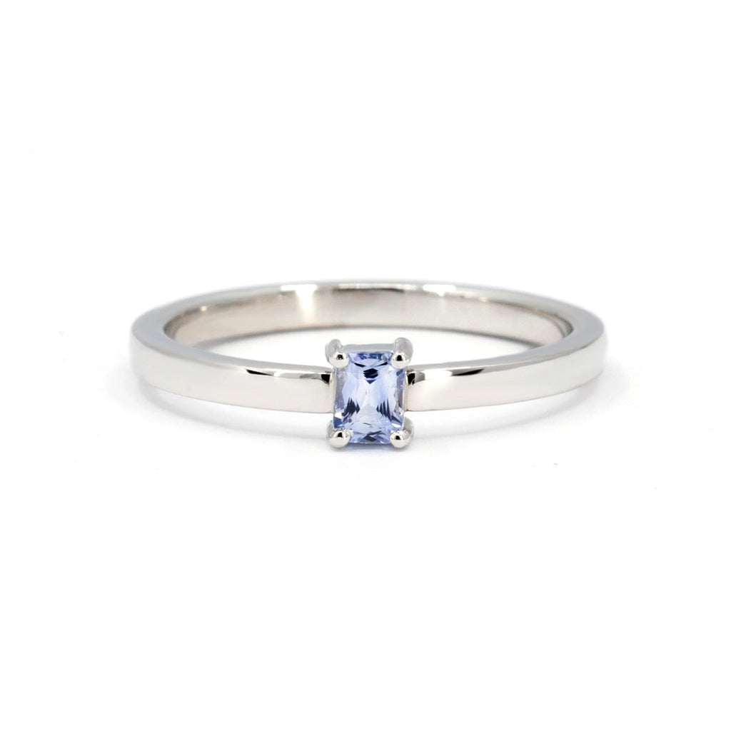 The Ruby Mardi jewelry store presents a collection of minimalist engagement rings made in white gold with a rectangular light blue sapphire. This natural gemstone ring is simple and timeless and is perfect as an alternative and one-of-a-kind bridal ring.