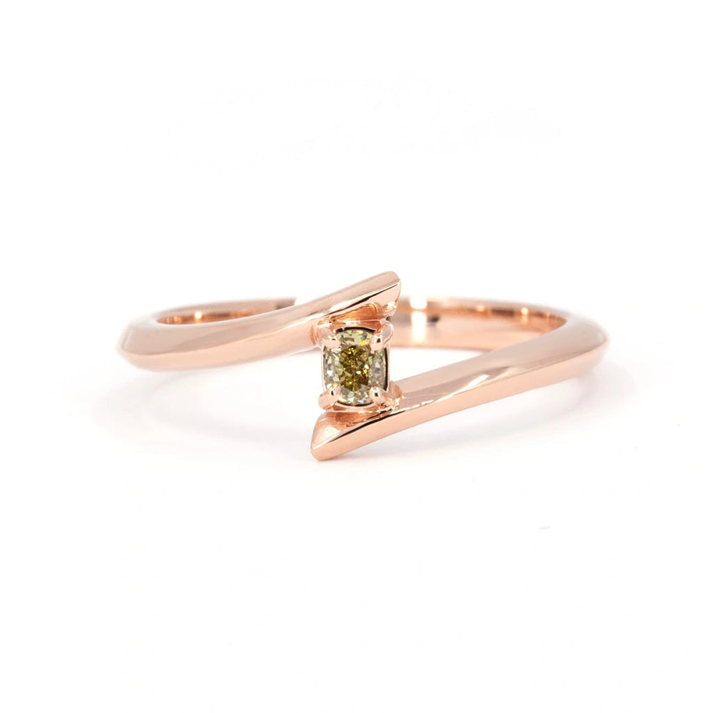 Original jewelry piece photographed on a white background: this independent jewelry was handmade in Canada by Ruby Mardi, the best jewelry store in Canada that offers canadian jewelry from the best designers. Here, a rose gold open ring with a yellow diamond.