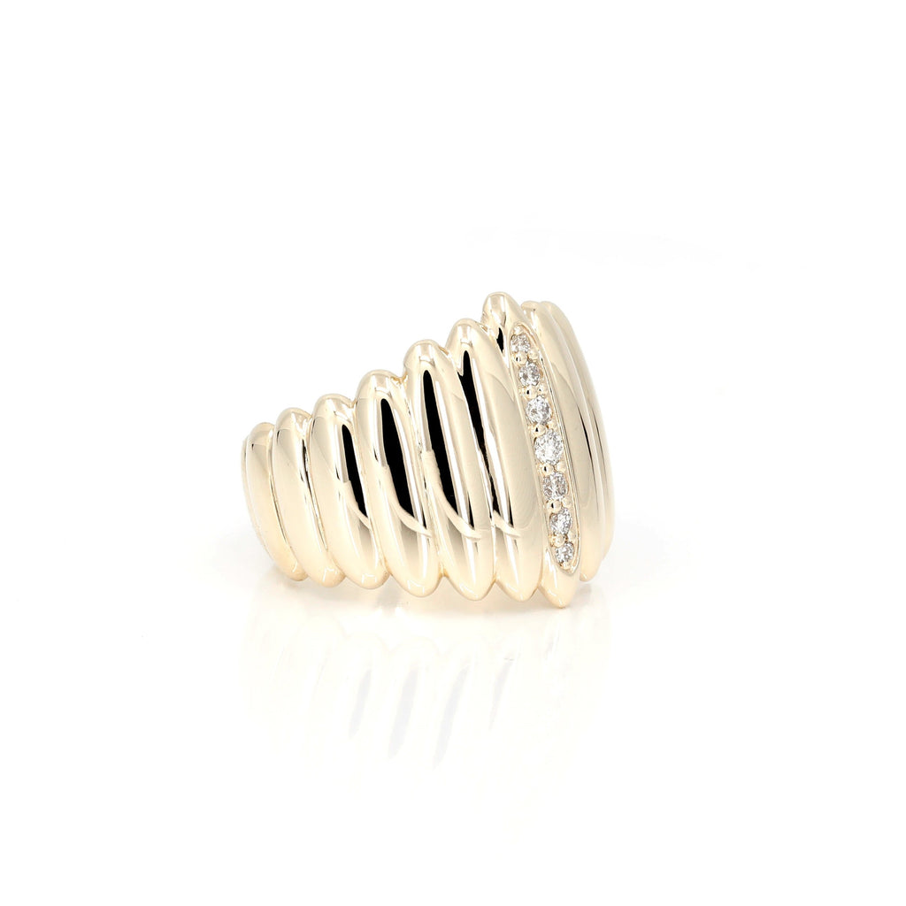 The Pigalle ring is part of the Fancy Edgy collection by independent Canadian designer Bena Jewelry. Made with diamonds, this ring is minimalist and super cool with a bold style. This unisex fine jewelry is available at Montreal's finest jewelry store Ruby Mardi.