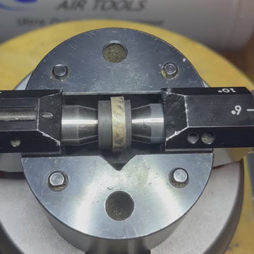 Video showing a gold wedding band by Rebel & Rogue with floral motifs sketched in pencil before engraving. The ring is secured on a jeweller’s engraving block at the workbench, offering a behind-the-scenes look at the hand-engraving process and the artist’s detailed preparation work.