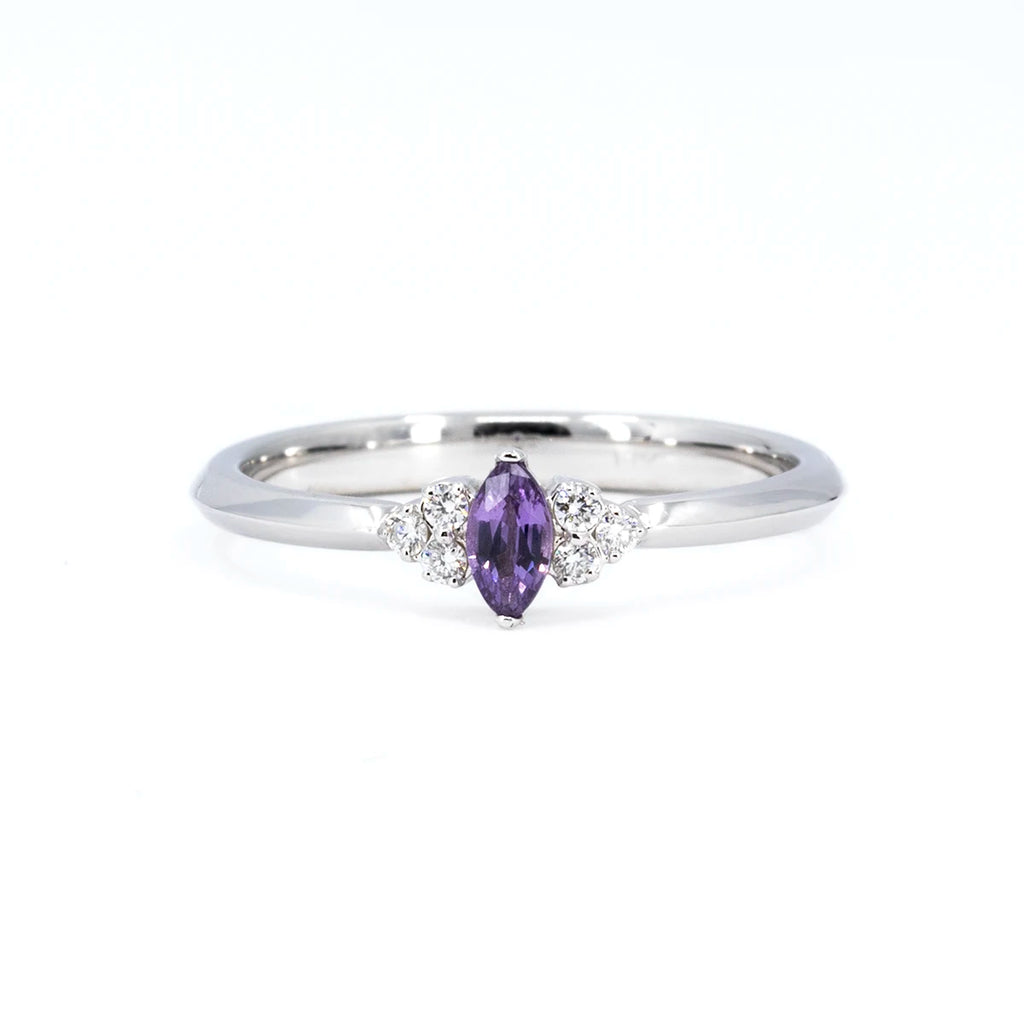 Ruby Mardi jewelry specializes in delicate engagement rings with a marquise-shaped purple sapphire and several diamonds set in white gold. This bridal jewelry is made in Canada and immediately available for sale online or in our showroom in Montreal.