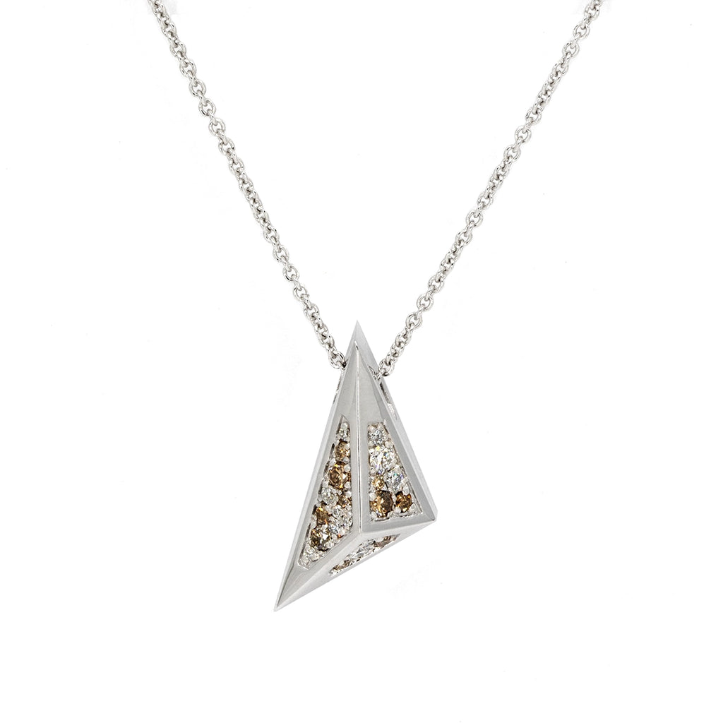 Ruby Mardi designer jewelry – Bena Jewelry Diamond Pyramid Pendant in 14k white gold, set with white diamonds and golden-brown diamonds. Modern unisex pendant with a bold angular pyramidal design, crafted to stand out with brilliance and edge.