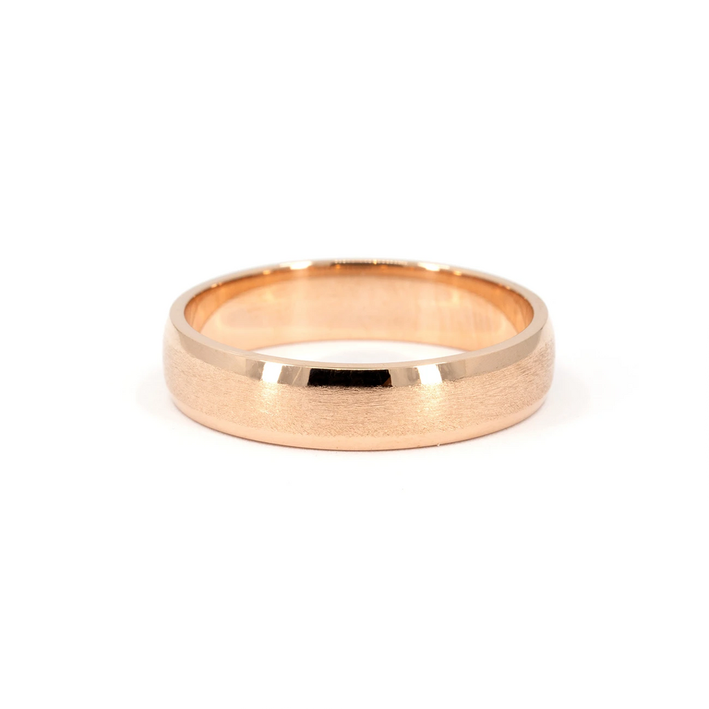 Rose gold wedding band with matte center and polished edges, 5.5mm wide, unisex design by Ruby Mardi Jewelry, handcrafted in Canada.