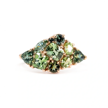 Bold Avalanche ring in 14k rose gold featuring a stunning cluster of green gemstones, including sapphires, garnets and teal diamonds. A statement piece handcrafted by Ruby Mardi in Montreal.