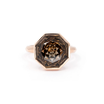 A striking octagon smoky quartz cocktail ring designed by Bena Jewelry, featuring a beautifully faceted gemstone set in a sleek rose gold bezel. Handcrafted with precision, this bold and modern statement piece is available exclusively at Ruby Mardi, a boutique specializing in unique artisan jewelry.