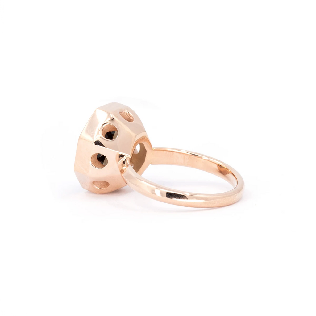A side profile of a handcrafted octagon smoky quartz cocktail ring by Bena Jewelry, featuring a rose gold bezel with geometric cutout details. This modern and elegant design highlights the exceptional craftsmanship, available exclusively at Ruby Mardi boutique.
