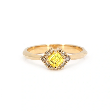 Yellow gold ring featuring a square asscher-cut yellow diamond at the center, framed by clusters of champagne diamonds in a geometric halo design. Elegant and unique bridal or statement ring, photographed on a white background.