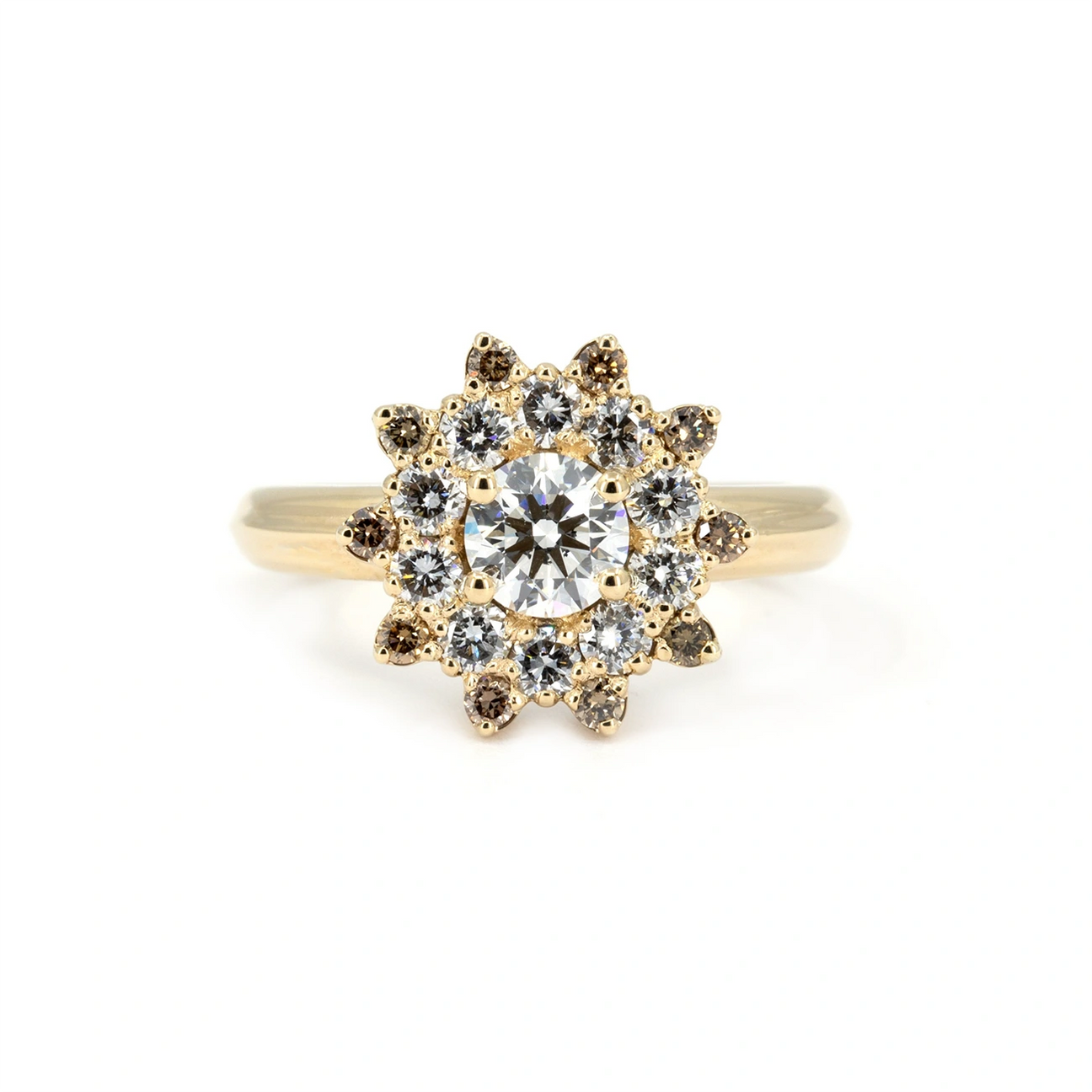 Yellow gold ring with a round brilliant-cut diamond at the center, surrounded by a radiant halo of white and brown diamonds forming a sun-inspired design. Handmade in Montreal by Bena Jewelry.