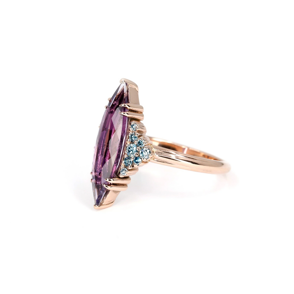 Side profile of marquise amethyst statement ring with clusters of blue diamonds, handcrafted in rose gold – Bena Jewelry, Ruby Mardi Montreal.