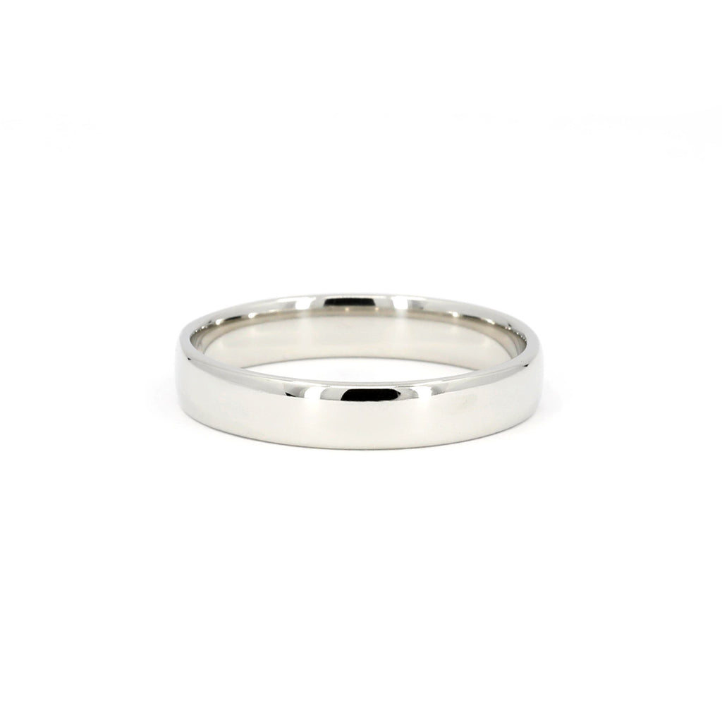 Classic 4mm white gold wedding band for him, photographed on a white background. A wedding band handmade in Montreal by the best jewelry store, Ruby Mardi.