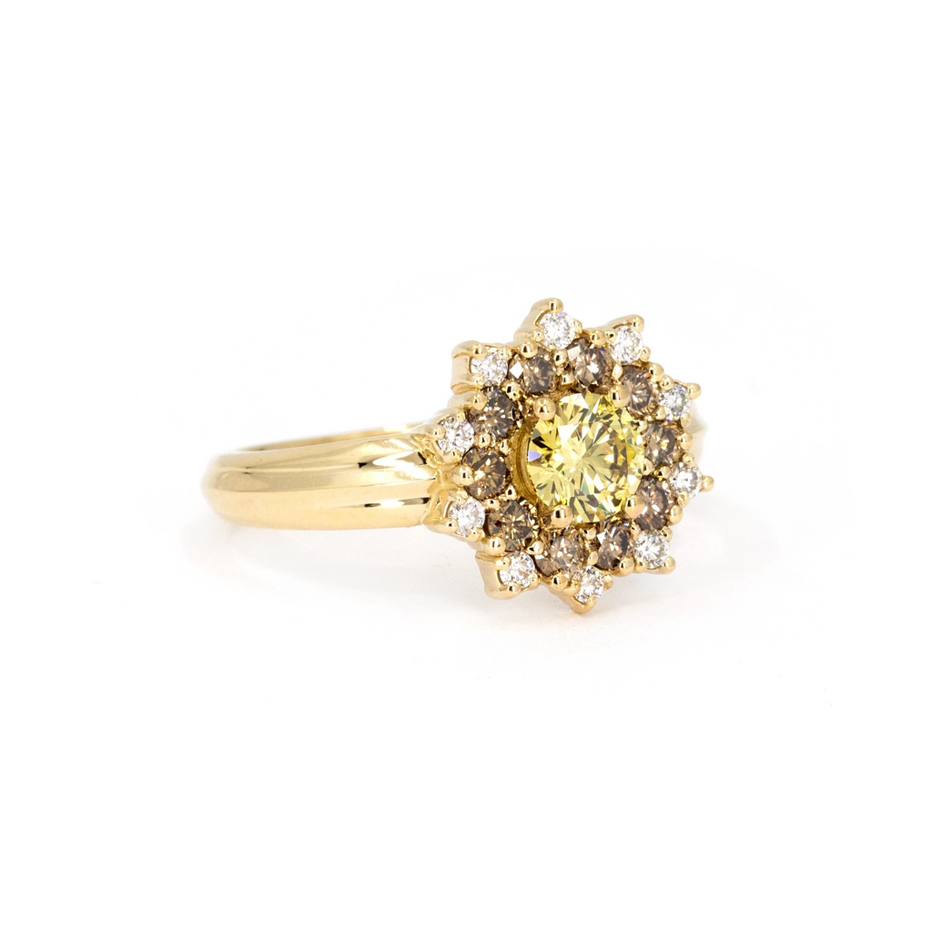 Product photo of a sun-shaped ring with a side view against a white background. The ring features a wide yellow gold band adorned with a central round yellow laboratory diamond, accented by round gold/brown diamonds and white diamonds. This stunning alternative engagement ring is crafted by independent high-end jewelry designer Bena Jewelry, showcasing exquisite craftsmanship and design.
