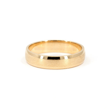 Yellow gold wedding band with matte center and polished edges, 5.5mm wide, handcrafted unisex ring by Ruby Mardi Jewelry, made in Canada.