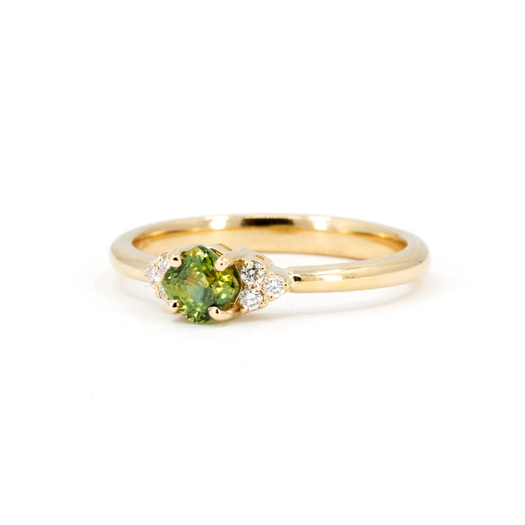 Dainty engagement ring with a green sapphire. More bridal jewelry and designer jewellery is available at our Montreal's store or online. Ruby Mardi is the #1 jewelry store in Canada.
