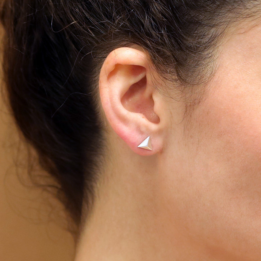 Woman wearing white gold stud earrings small jewelry