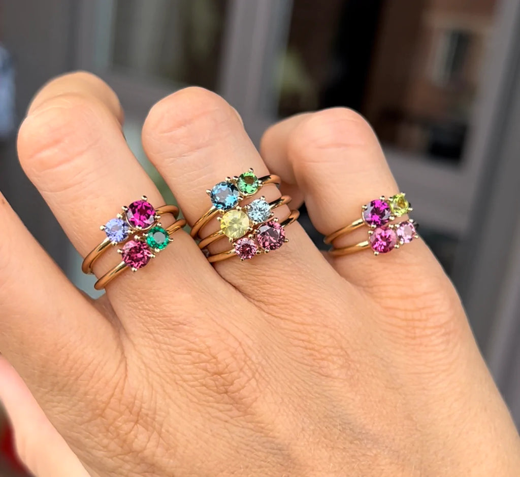 girl hand wearing stacables colored gemstone gold rings jewelry store showroom in montreal boutique ruby mardi fine canadian designer quebec out door