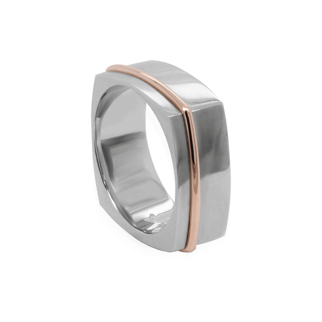 side view of men wedding band custom made white and rose gold ring designer ring made by artisan desginer Janine de Dorigny in montreal for jewelry store montreal boutique ruby mardi on a white background
