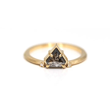 Splendid Ayres ring from independent jewelry designer Liane Vaz made with a salt and pepper triangle diamond. This artisan Canadian jeweler is represented by the fine jewelry store Ruby Mardi based in Montreal. Minimalist jewelry with an edgy touch is in yellow gold.