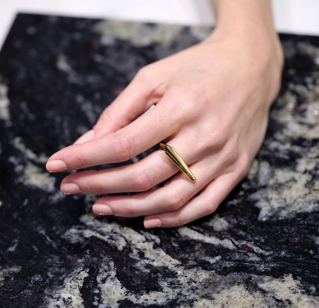 Allure unisex statement ring in gold vermeil by Bena Jewelry, worn by a lady and photographed in close-up. Ready-to-wear fashion jewelry available online or in Montreal's Little Italy.