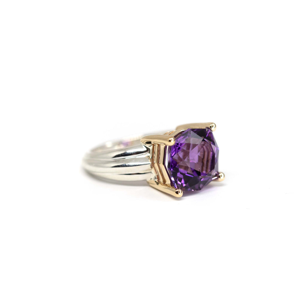 Statement ring with exceptional two-tone amethyst. Gemstone set in 14K gold, and sterling silver band. A fabulous cocktail ring created by Montreal jewelry designer Bena Jewelry, available at Ruby Mardi. The fine jewelry gallery features the work of talented Canadian jewelry designers, and offers custom jewelry design services. 