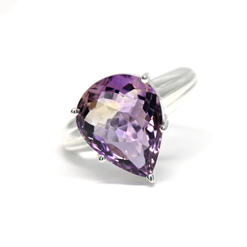 Edgy ring from Canadian jewelry designer Bena Jewelry featuring a big stunning ametrine on a silver band. Find more cocktail rings and statement rings at Ruby Mardi, a fine jewelry gallery in Little Italy Montreal, not far from Outremont, Villeray, Mile End, Mile Ex and Rosemont districts. Engagement rings and Custom jewelry services also offered.