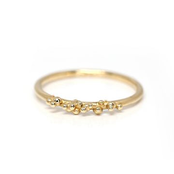 Areia ring in its heavy version by Meg Lizabet Jewellery. An handmade organic ring with gold granules. Find it at Ruby Mardi in Montreal.